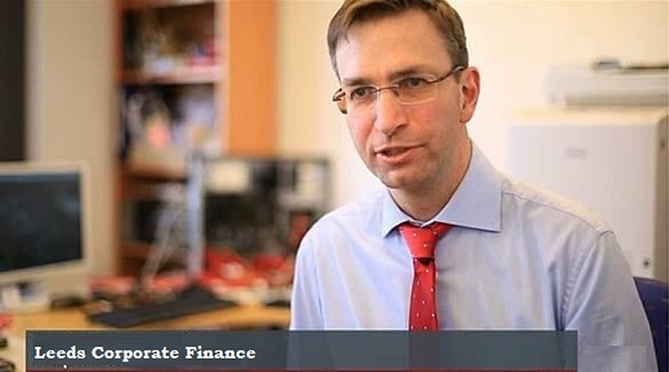 Leeds Corporate Finance CEO Paul Merriman with the Leeds Corporate Finance logo background